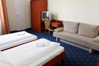Ein Bett oder Betten in einem Zimmer der Unterkunft Hotel Europa City