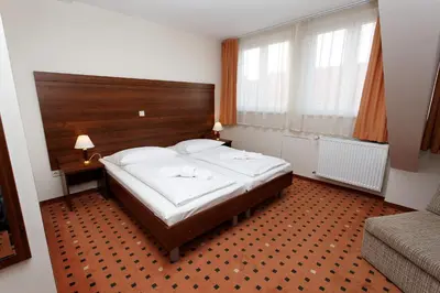 Ein Bett oder Betten in einem Zimmer der Unterkunft Hotel Europa City