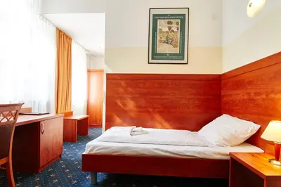 Ein Bett oder Betten in einem Zimmer der Unterkunft Hotel Europa City