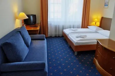 Ein Bett oder Betten in einem Zimmer der Unterkunft Hotel Europa City