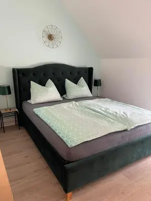 Ein Bett oder Betten in einem Zimmer der Unterkunft Ferienwohnung Unter den Linden
