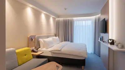 Ein Bett oder Betten in einem Zimmer der Unterkunft Holiday Inn Express & Suites - Potsdam by IHG