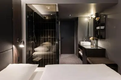 Ein Bett oder Betten in einem Zimmer der Unterkunft Hotel ROMY by AMANO