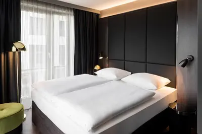 Ein Bett oder Betten in einem Zimmer der Unterkunft Hotel ROMY by AMANO