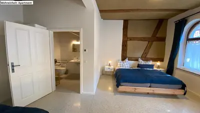 Ein Bett oder Betten in einem Zimmer der Unterkunft Blaue Perle Templin