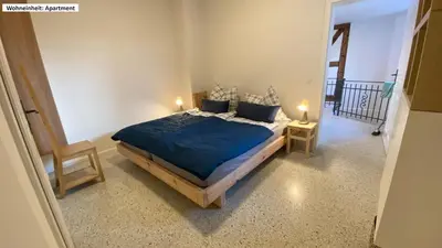 Ein Bett oder Betten in einem Zimmer der Unterkunft Blaue Perle Templin