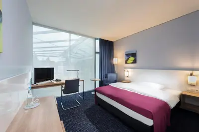 Ein Bett oder Betten in einem Zimmer der Unterkunft Seminaris CampusHotel Berlin