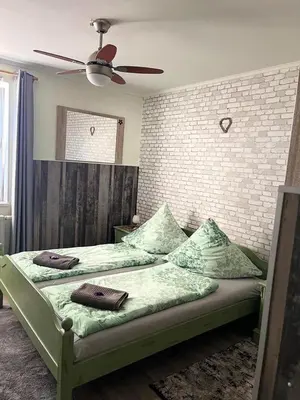 Ein Bett oder Betten in einem Zimmer der Unterkunft Hotel Auberge Restaurant