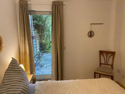 Ein Bett oder Betten in einem Zimmer der Unterkunft Einliegerwohnung mit Wintergarten (EG)