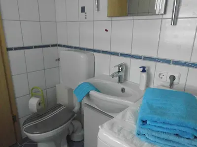 Ein Badezimmer in der Unterkunft Bungalow Idylle Am See