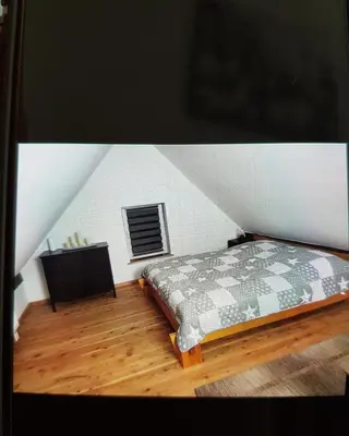 Ein Bett oder Betten in einem Zimmer der Unterkunft Ferienwohnung Schmenkel