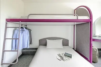 Ein Bett oder Betten in einem Zimmer der Unterkunft T3 Budget Berlin Hennigsdorf