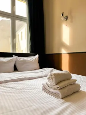 Ein Bett oder Betten in einem Zimmer der Unterkunft Pension Am Park