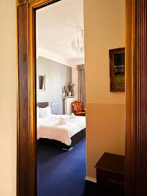 Ein Bett oder Betten in einem Zimmer der Unterkunft Pension Am Park
