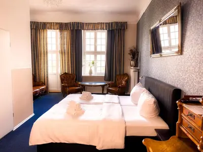 Ein Bett oder Betten in einem Zimmer der Unterkunft Pension Am Park