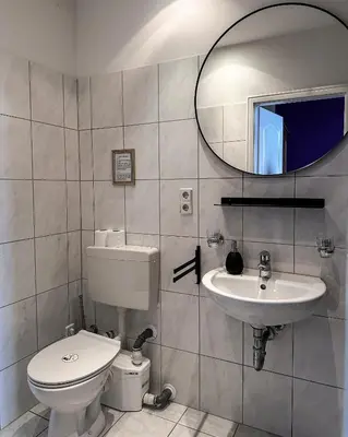 Ein Badezimmer in der Unterkunft Pension Am Park