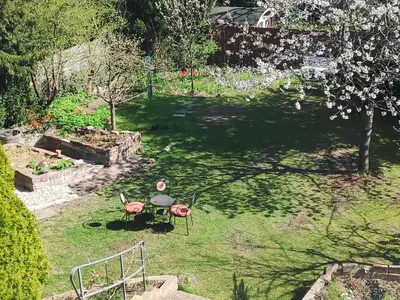 Ein Garten an der Unterkunft Mini-Apartment ruhig und verkehrsgünstig in Berlin