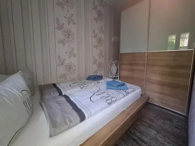 Ein Bett oder Betten in einem Zimmer der Unterkunft Ferienhaus Püttbergeweg, Berlin