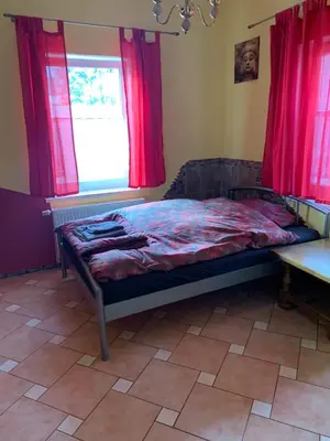 Ein Bett oder Betten in einem Zimmer der Unterkunft Pension SXF