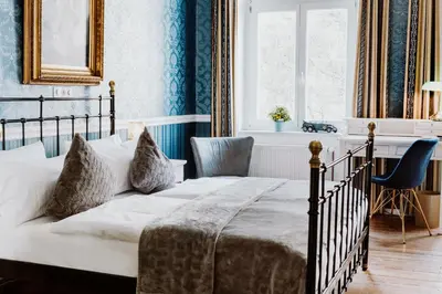 Ein Bett oder Betten in einem Zimmer der Unterkunft Honigmond Boutique Hotel