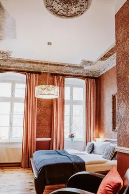 Ein Bett oder Betten in einem Zimmer der Unterkunft Honigmond Boutique Hotel