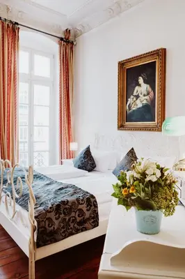 Ein Bett oder Betten in einem Zimmer der Unterkunft Honigmond Boutique Hotel