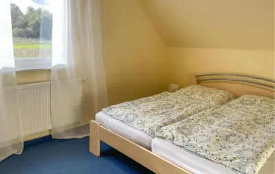 Ein Bett oder Betten in einem Zimmer der Unterkunft Ferienhaus Seeblick H