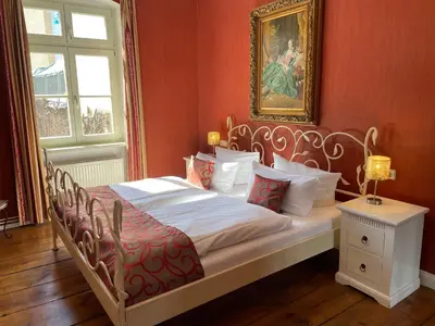Ein Bett oder Betten in einem Zimmer der Unterkunft THE GATE GARDEN Hotel