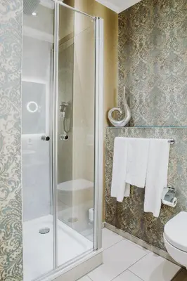 Ein Badezimmer in der Unterkunft THE GATE GARDEN Hotel