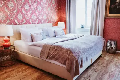 Ein Bett oder Betten in einem Zimmer der Unterkunft THE GATE GARDEN Hotel