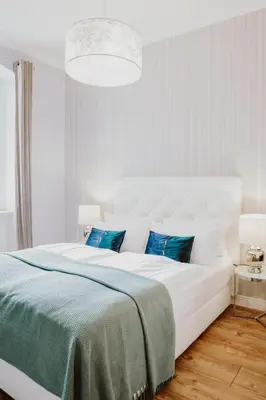 Ein Bett oder Betten in einem Zimmer der Unterkunft THE GATE GARDEN Hotel