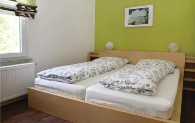 Ein Bett oder Betten in einem Zimmer der Unterkunft Ferienhaus Blossiner Weg U