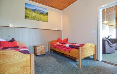 Ein Bett oder Betten in einem Zimmer der Unterkunft Ferienhaus E.-Th�lmann-Str. H
