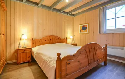 Ein Bett oder Betten in einem Zimmer der Unterkunft Ferienhaus Am Schilfhaus L