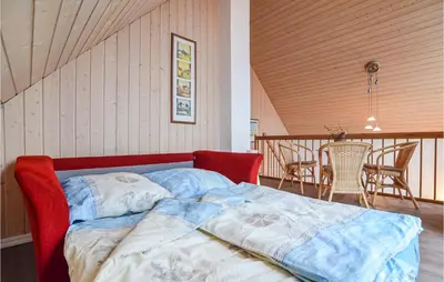 Ein Bett oder Betten in einem Zimmer der Unterkunft Ferienhaus Am Schilfhaus L
