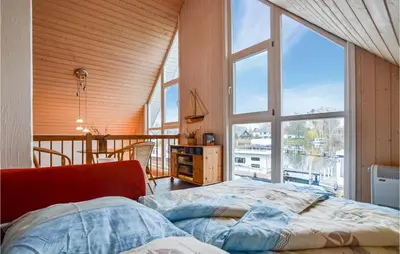 Ein Bett oder Betten in einem Zimmer der Unterkunft Ferienhaus Am Schilfhaus L