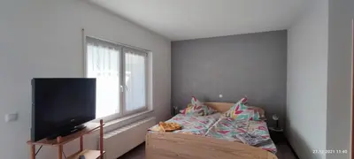 Ein Bett oder Betten in einem Zimmer der Unterkunft Pension und Ferienwohnung Walther