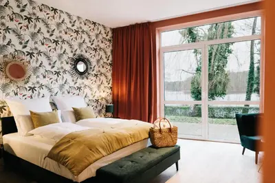 Ein Bett oder Betten in einem Zimmer der Unterkunft Landhaus am See - Gästezimmer