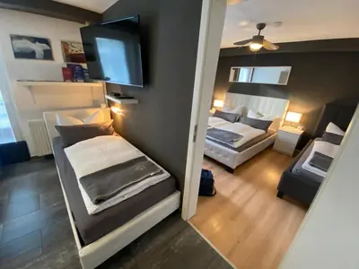 Ein Bett oder Betten in einem Zimmer der Unterkunft City Holiday Apartments Berlin