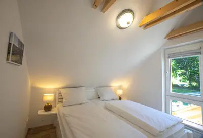 Ein Bett oder Betten in einem Zimmer der Unterkunft Hirtenhaus 28b Obergeschoss