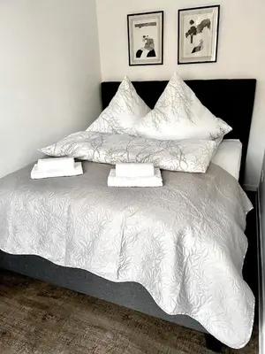 Ein Bett oder Betten in einem Zimmer der Unterkunft Ferienwohnung Kamrath