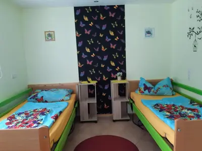 Ein Bett oder Betten in einem Zimmer der Unterkunft Monikas Gästehäuser Seeblick Himmelpfort