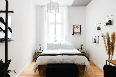 Ein Bett oder Betten in einem Zimmer der Unterkunft 4-Zi Urban Design 120m² BRANDNEW 200Mbit