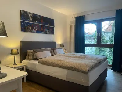 Ein Bett oder Betten in einem Zimmer der Unterkunft COSY PANKOW HOMES - Studios mit TV Stick