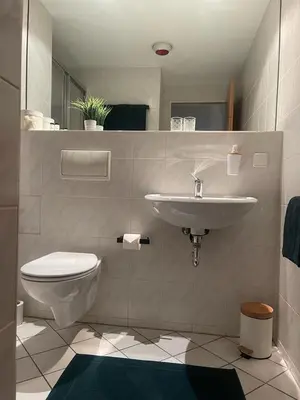 Ein Badezimmer in der Unterkunft COSY PANKOW HOMES - Studios mit TV Stick