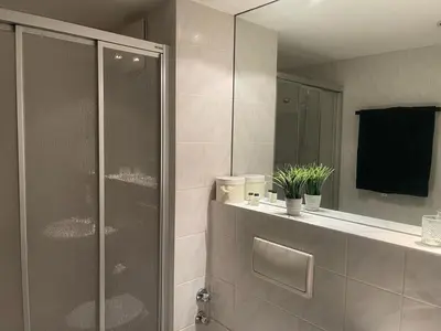Ein Badezimmer in der Unterkunft COSY PANKOW HOMES - Studios mit TV Stick