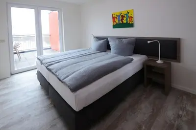 Ein Bett oder Betten in einem Zimmer der Unterkunft Havel-Spitze Ferienwohnungen