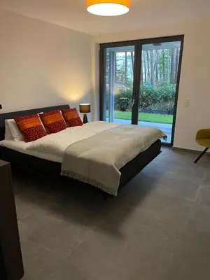 Ein Bett oder Betten in einem Zimmer der Unterkunft Basalt Lodge am Lehnitzsee