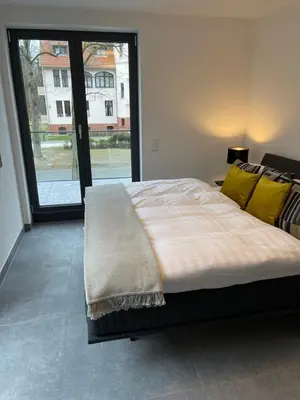 Ein Bett oder Betten in einem Zimmer der Unterkunft Basalt Lodge am Lehnitzsee