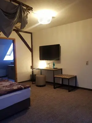 Ein Bett oder Betten in einem Zimmer der Unterkunft Ritterhof Kampehl